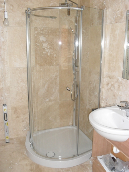 Bathroom fitters in Cirencester, floor to ceiling tiling, power showers installed, bathroom floor tiling Cirencesrer Glos
